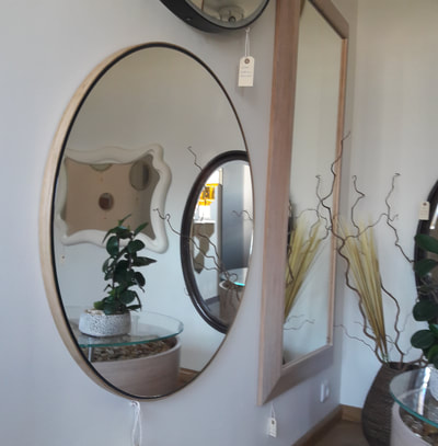 large round mirror with wood frame