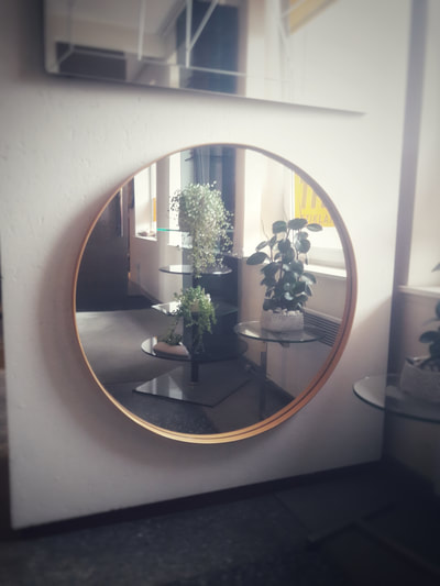 large round gold wall mirror