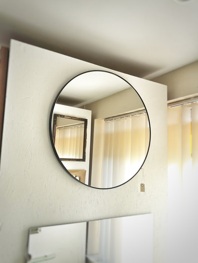 Round mirror with black frame